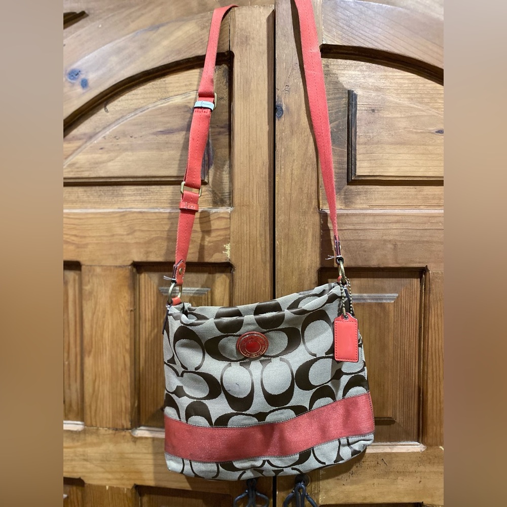 Good used authentic Coach messenger crossbody purse, tan and burnt orange